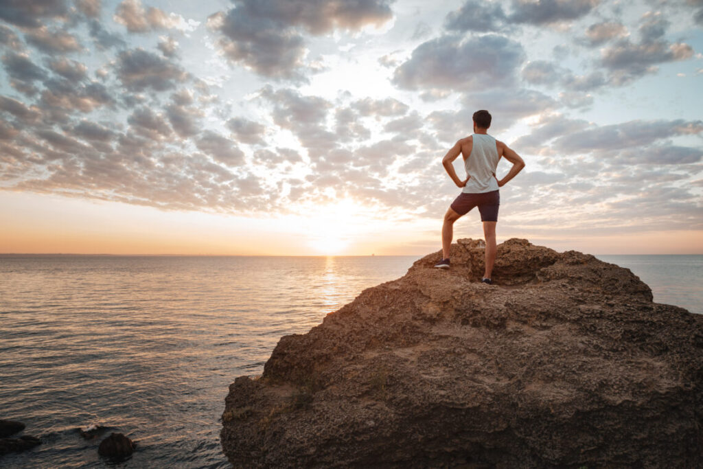 man enjoying sunset signifying new life and routine